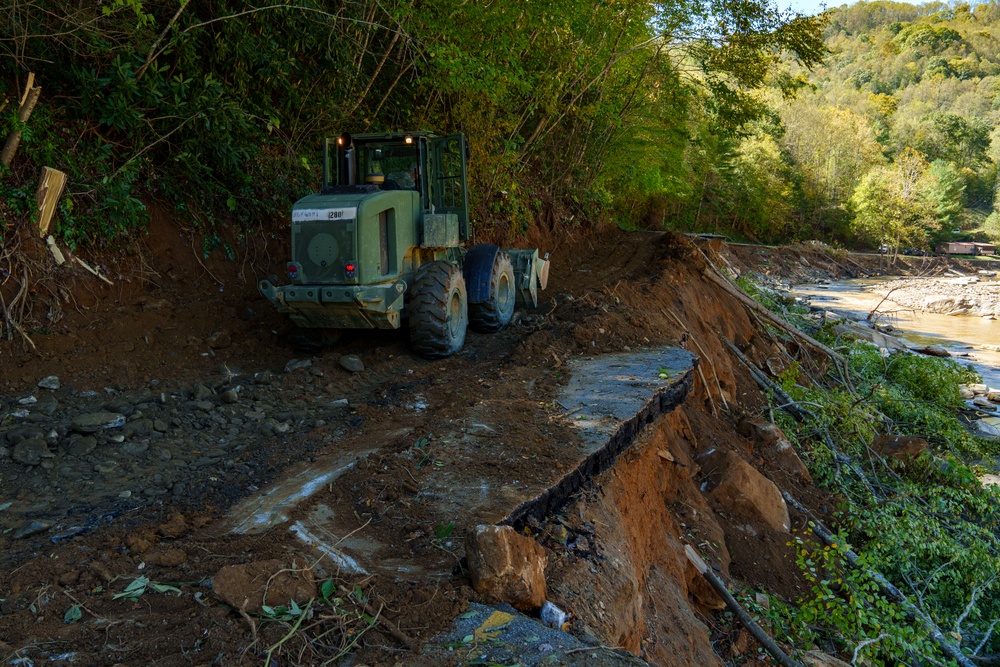 North Carolina National Guard soldiers reinforce a temporary dirt roadway