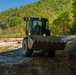 North Carolina National Guard Soldiers reinforce a temporary dirt roadway