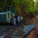 North Carolina National Guard Soldiers reinforce a temporary dirt roadway
