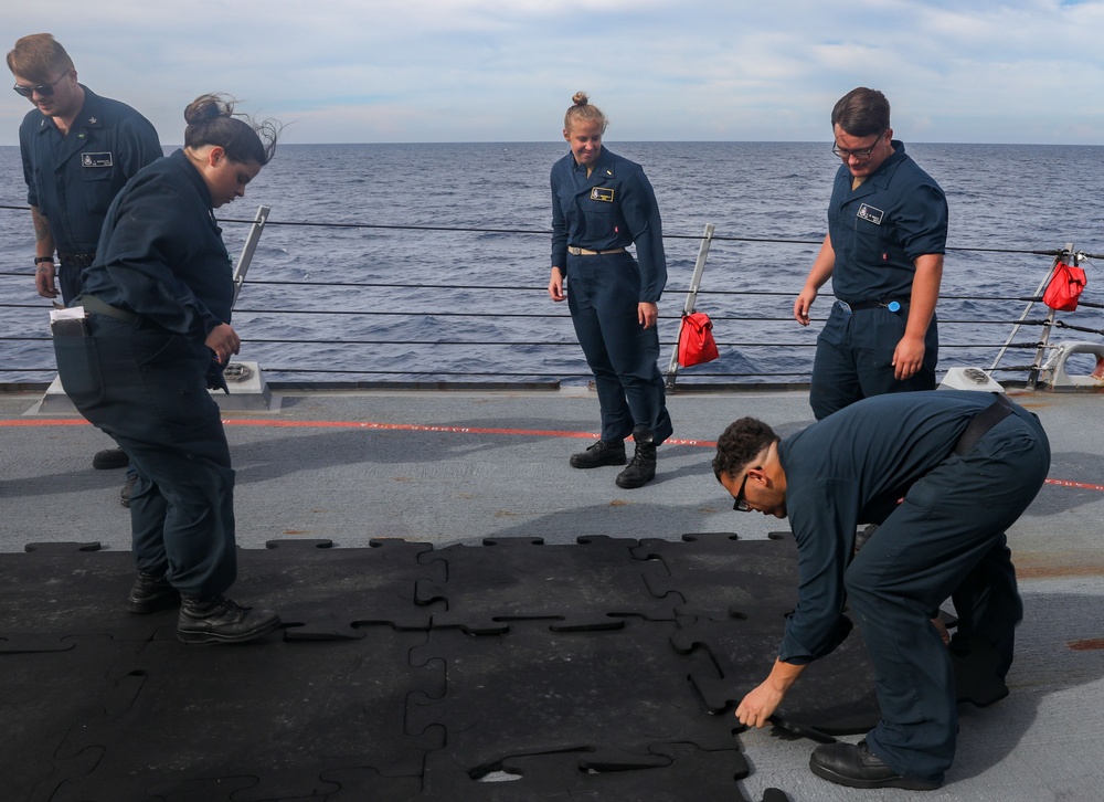 Sailors aboard the USS Howard make preparations for a gunnery exercise during Sama Sama 2024