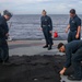 Sailors aboard the USS Howard make preparations for a gunnery exercise during Sama Sama 2024