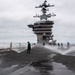 USS Carl Vinson (CVN 70) Sailors Conduct a Counter-Measure Washdown on the Flight Deck