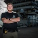 Naval Criminal Investigative Service (NCIS) Special Agent Afloat (SAA) Justin Botkin stand for an environmental portrait on the flight deck of the aircraft carrier USS Harry S. Truman (CVN 75) at Norfolk Naval Station Virginia on 19 September 2024.