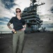 Naval Criminal Investigative Service (NCIS) Special Agent Afloat (SAA) Bernadette Duffy poses for an environmental portrait on the flight deck of the US Navy aircraft carrier USS Harry S. Truman (CVN 75)