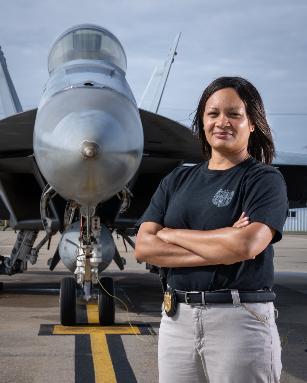 Naval Criminal Investigative Service (NCIS) Supervisory Special Agent (SSA) Jennifer Lynch around the flight line with F-18 Hornets and the U. S. Navy's Flight Demonstration Team, Blue Angels