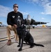 Naval Criminal Investigative Service (NCIS) Special Agent (SA) David Lawhorn and his K-9 companion Jill around the flight line with F-18 Hornets and the U. S. Navy's Flight Demonstration Team, Blue Angels