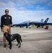 Naval Criminal Investigative Service (NCIS) Special Agent (SA) David Lawhorn and his K-9 companion Jill around the flight line with F-18 Hornets and the U. S. Navy's Flight Demonstration Team, Blue Angels