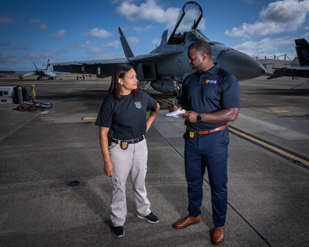 Naval Criminal Investigative Service (NCIS) Supervisory Special Agent (SSA) Jennifer Lynch and Special Agent (SA) Kenneth Randle discuss an on-going investigation