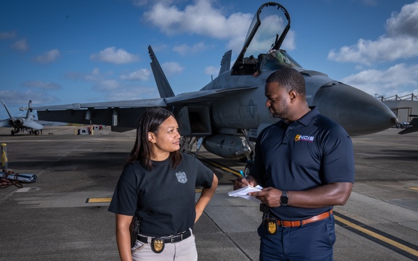 Naval Criminal Investigative Service (NCIS) Supervisory Special Agent (SSA) Jennifer Lynch and Special Agent (SA) Kenneth Randle discuss an on-going investigation