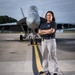 Naval Criminal Investigative Service (NCIS) Supervisory Special Agent (SSA) Jennifer Lynch around the flight line with F-18 Hornets