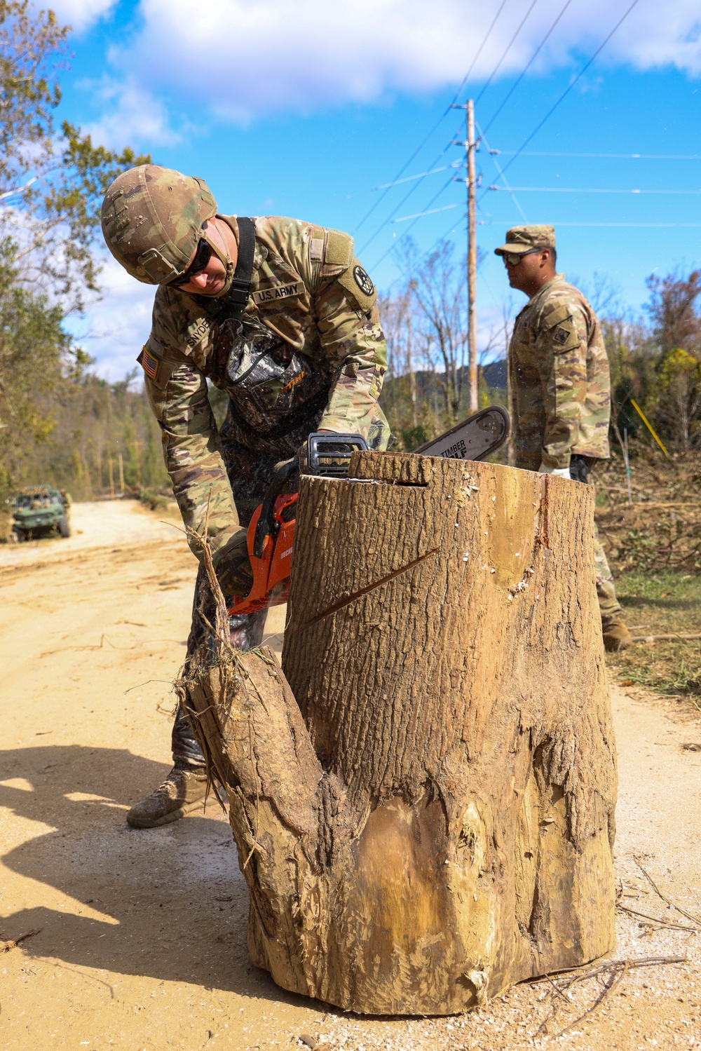 882nd Engineer Company, 505th Engineer Battalion, remove debris from a blocked roadway