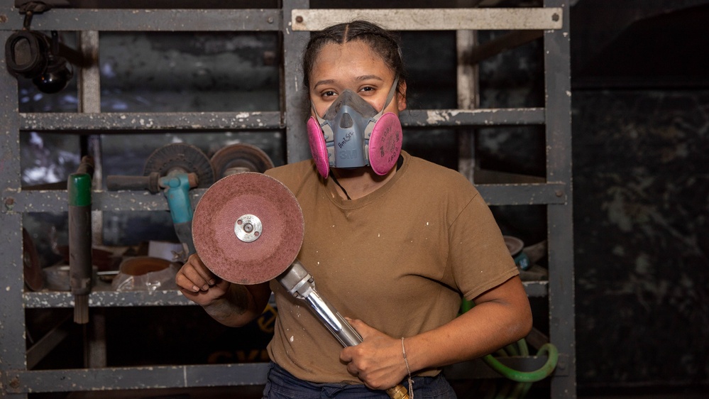 USS George Washington Sailor Grinds Metal for Paint Preparation