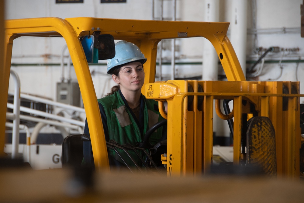 Nimitz Sailor Drives a Forklift