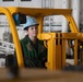 Nimitz Sailor Drives a Forklift