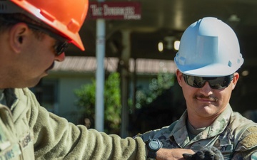 Tennessee Army National Guardsmen clear debris on Denton Road in Cocke County, Tennessee