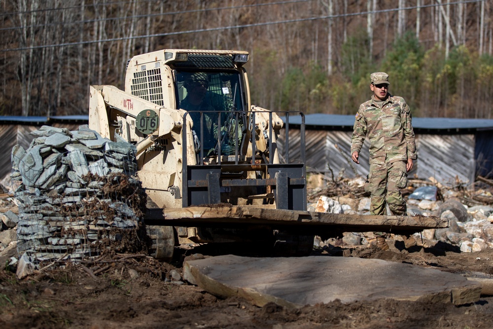 161st Engineer Support Company (Airborne) removes debris during route clearance near Green Creek in Bakersville, North Carolina