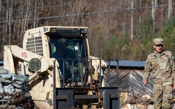 161st Engineer Support Company (Airborne) removes debris during route clearance near Green Creek in Bakersville, North Carolina