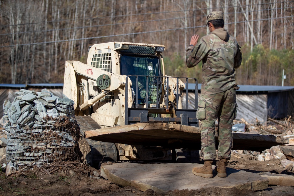 161st Engineer Support Company (Airborne) removes debris during route clearance near Green Creek in Bakersville, North Carolina