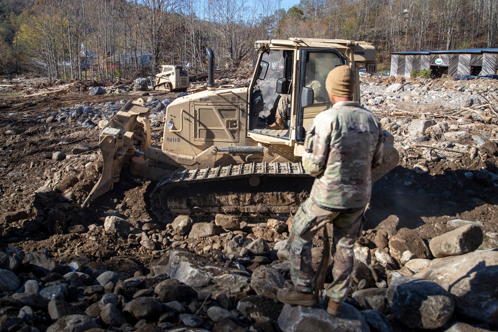 161st Engineer Support Company (Airborne) removes debris during route clearance near Green Creek in Bakersville, North Carolina