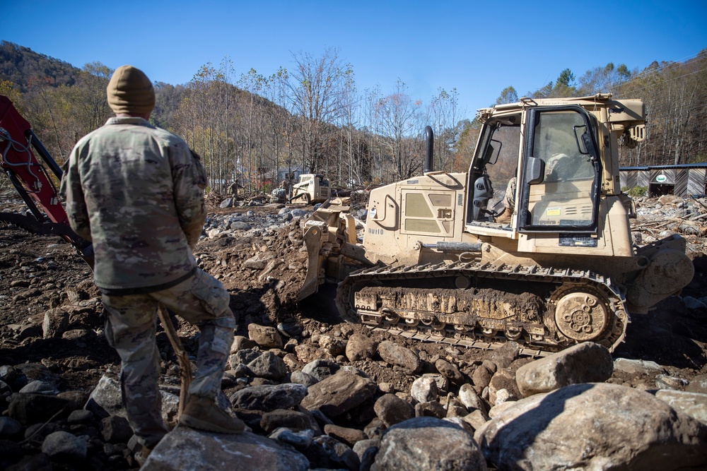 161st Engineer Support Company (Airborne) removes debris during route clearance near Green Creek in Bakersville, North Carolina