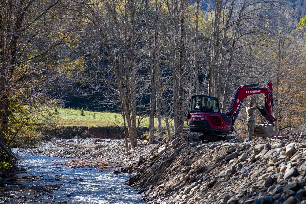 161st Engineer Support Company (Airborne) removes debris during route clearance near Green Creek in Bakersville, North Carolina