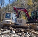 161st Engineer Support Company (Airborne) removes debris during route clearance near Green Creek in Bakersville, North Carolina