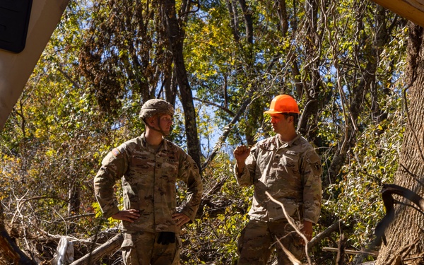 U.S. Army Soldiers assigned to 161st Engineer Support Company (Airborne), 27th Engineer Battalion (Airborne), 20th Engineer Brigade, XVIII Airborne Corps conduct route clearance in Swannanoa, North Carolina, Oct. 18th, 2024.
