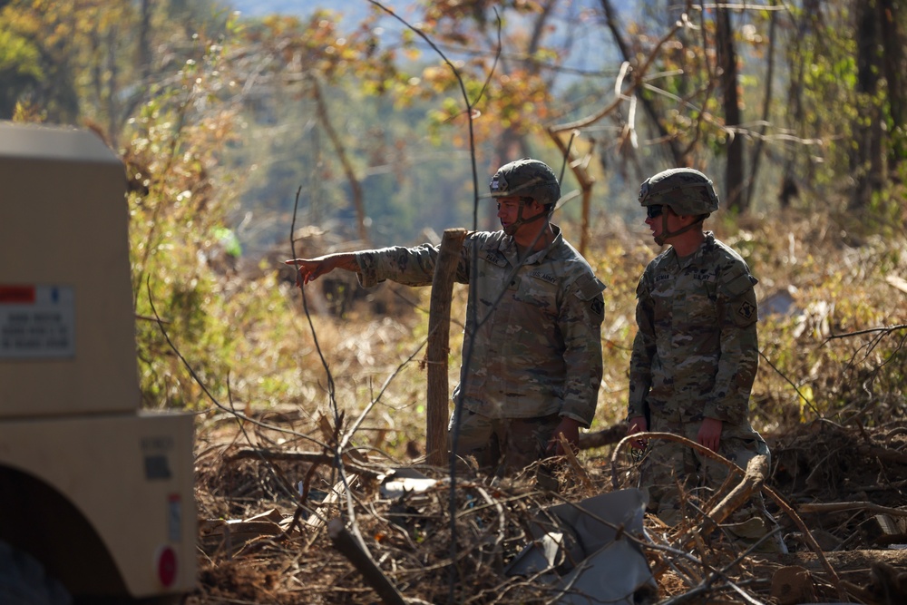 U.S. Army Soldiers assigned to 161st Engineer Support Company (Airborne), 27th Engineer Battalion (Airborne), 20th Engineer Brigade, XVIII Airborne Corps conduct route clearance in Swannanoa, North Carolina