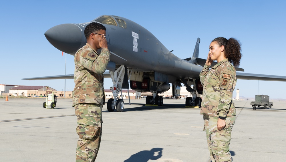 SSgt Xavier Collins, Crew Chief for the 912th Aircraft Maintenance Squadron, swears in for his re-enlistment ceremony in front of a B-1B Bomber at Edwards Air Force Base