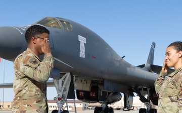 SSgt Xavier Collins, Crew Chief for the 912th Aircraft Maintenance Squadron, swears in for his re-enlistment ceremony in front of a B-1B Bomber at Edwards Air Force Base