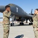 SSgt Xavier Collins, Crew Chief for the 912th Aircraft Maintenance Squadron, swears in for his re-enlistment ceremony in front of a B-1B Bomber at Edwards Air Force Base