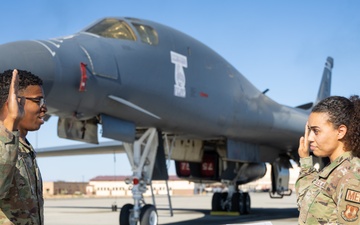 SSgt Xavier Collins, Crew Chief for the 912th Aircraft Maintenance Squadron, swears in for his re-enlistment ceremony in front of a B-1B Bomber at Edwards Air Force Base