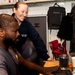 An Intelligence Specialist 2nd Class and the MWR fitness specialist plan MWR events for Sailors aboard USS Carl Vinson (CVN 70)