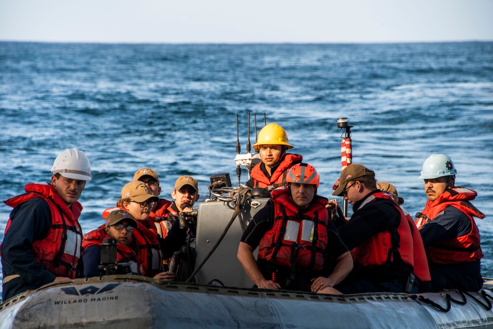 Sailors assigned to Nimitz-class aircraft carrier USS Carl Vinson (CVN 70) conduct small boat operations