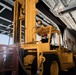 An Aviation Boatswain's Mate (Handling) Operates a Forklift