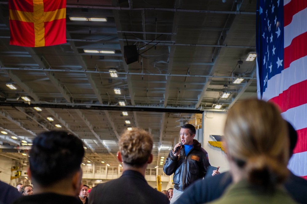 The Air Boss aboard Nimitz-class Aircraft Carrier USS Carl Vinson (CVN 70), speaks to Air Department