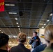 The Air Boss aboard Nimitz-class Aircraft Carrier USS Carl Vinson (CVN 70), speaks to Air Department