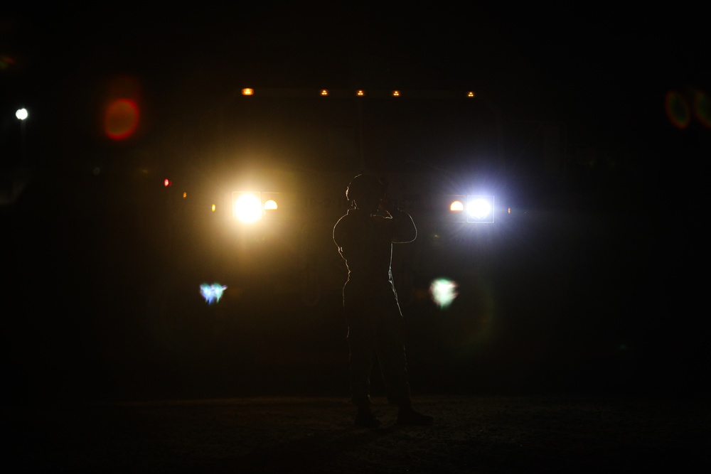 A Soldier Secures His Helmet Before Departure