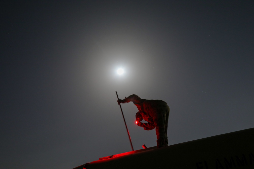 A Soldier Checks Fuel Levels