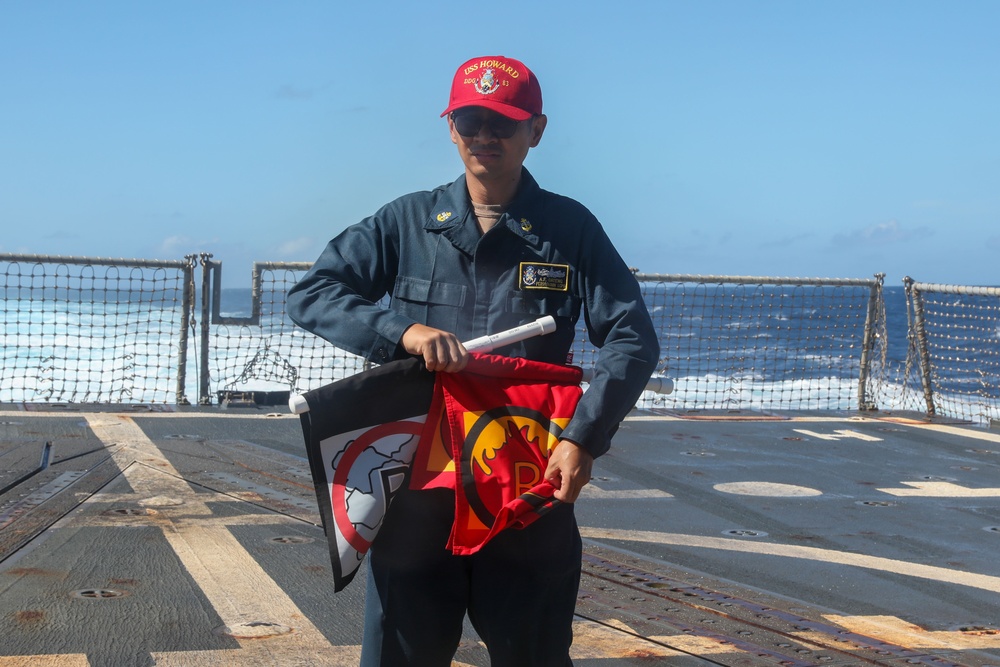 Sailors aboard the USS Howard conduct a crash and salvage drill in the South China Sea