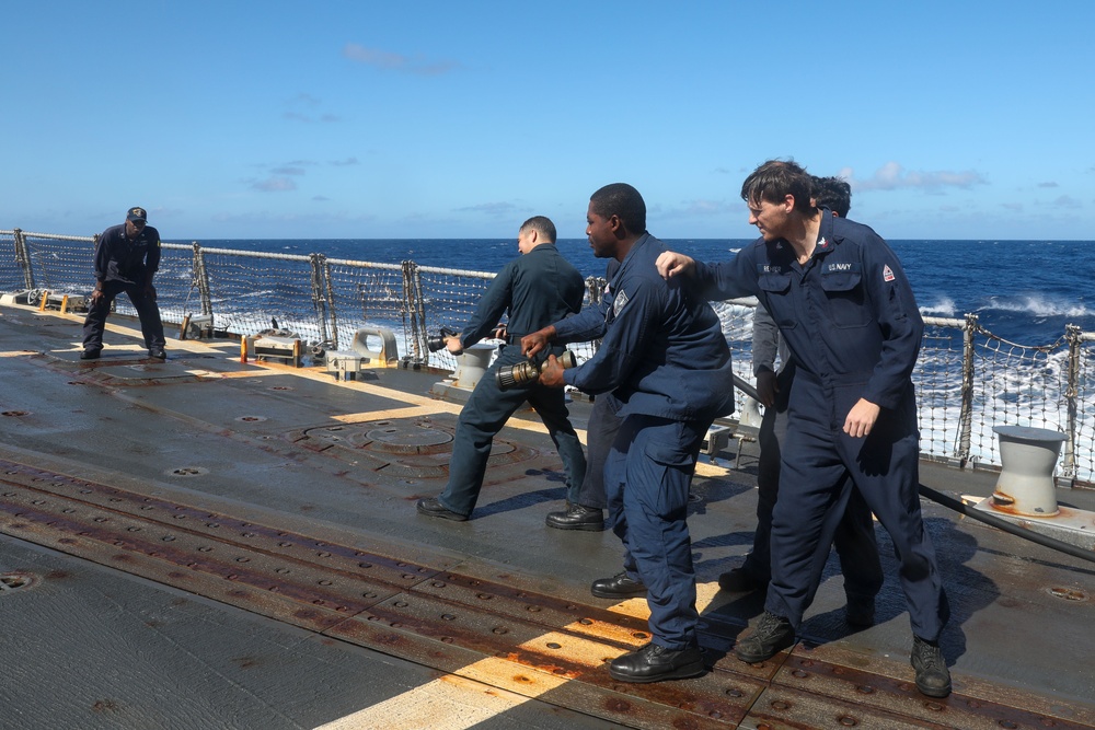 Sailors aboard the USS Howard conduct a crash and salvage drill in the South China Sea