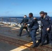 Sailors aboard the USS Howard conduct a crash and salvage drill in the South China Sea