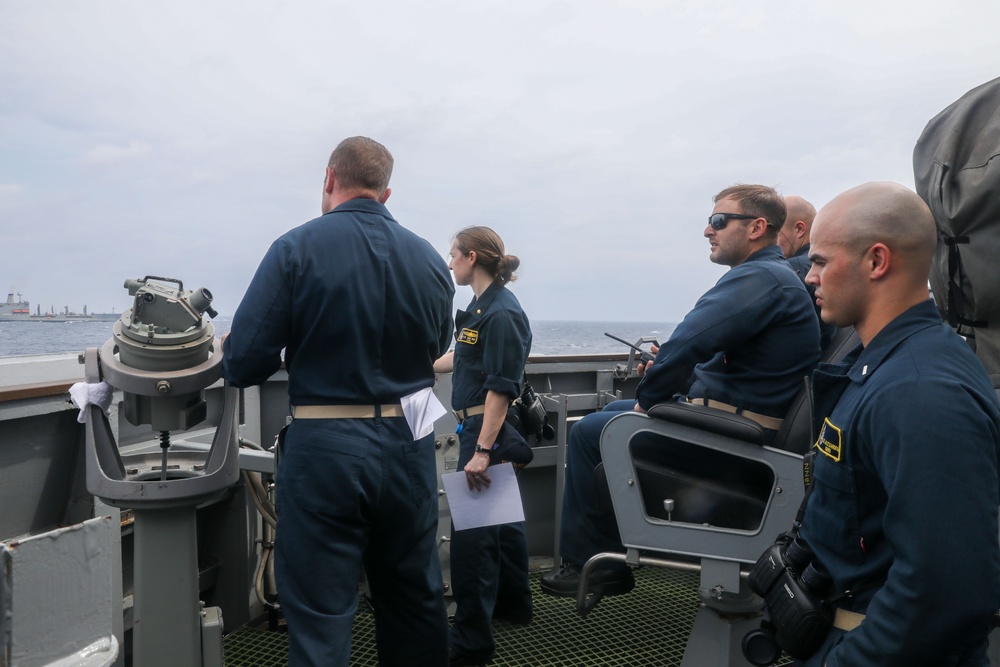 Sailors aboard the USS Howard conduct a replenishment-at-sea with the USNS Rappahannock