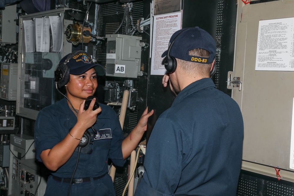 Sailors aboard the USS Howard conduct a replenishment-at-sea with the USNS Rappahannock in the South China Sea