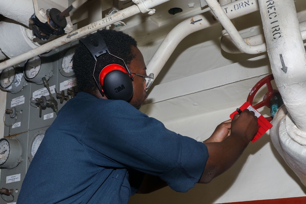 Sailors aboard the USS Howard conduct routine maintenance in the South China Sea