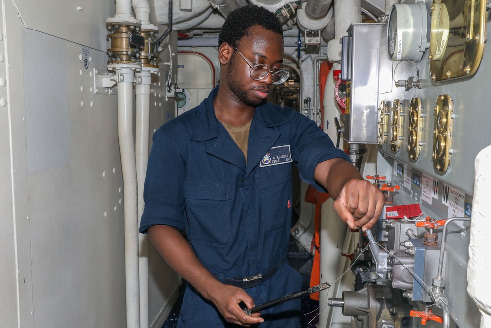 Sailors aboard the USS Howard conduct routine maintenance in the South China Sea