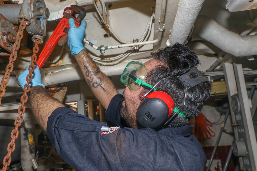 Sailors aboard the USS Howard conduct routine maintenance in the South China Sea