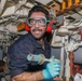 Sailors aboard the USS Howard conduct routine maintenance in the South China Sea