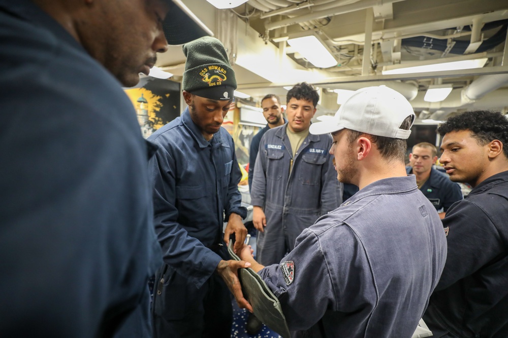 Sailors aboard the USS Howard conduct a general quarters drill in the South China Sea