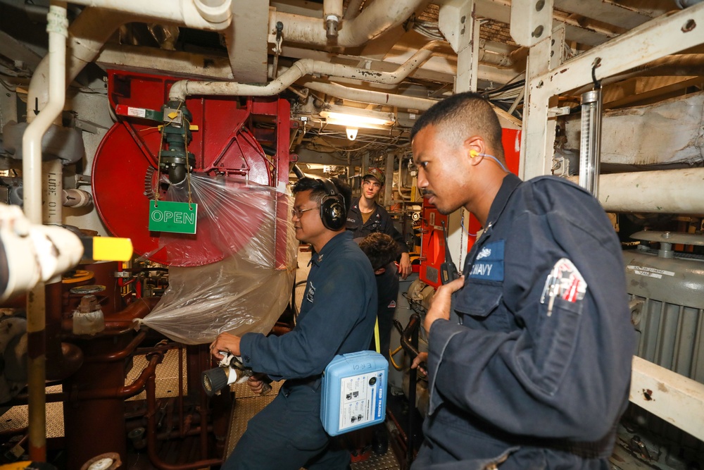 Sailors aboard the USS Howard conduct a general quarters drill in the South China Sea